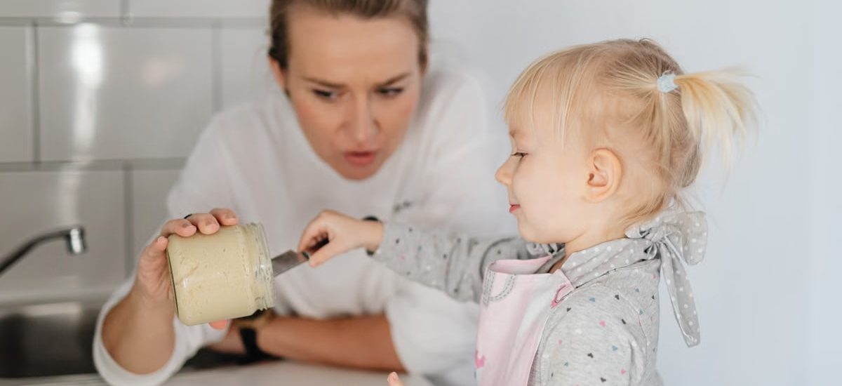 A mother and daughter bonding over baking, enjoying time in the kitchen.