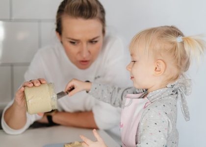 A mother and daughter bonding over baking, enjoying time in the kitchen.
